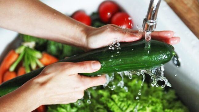 Washing vegetables to avoid infection with protozoan parasites.